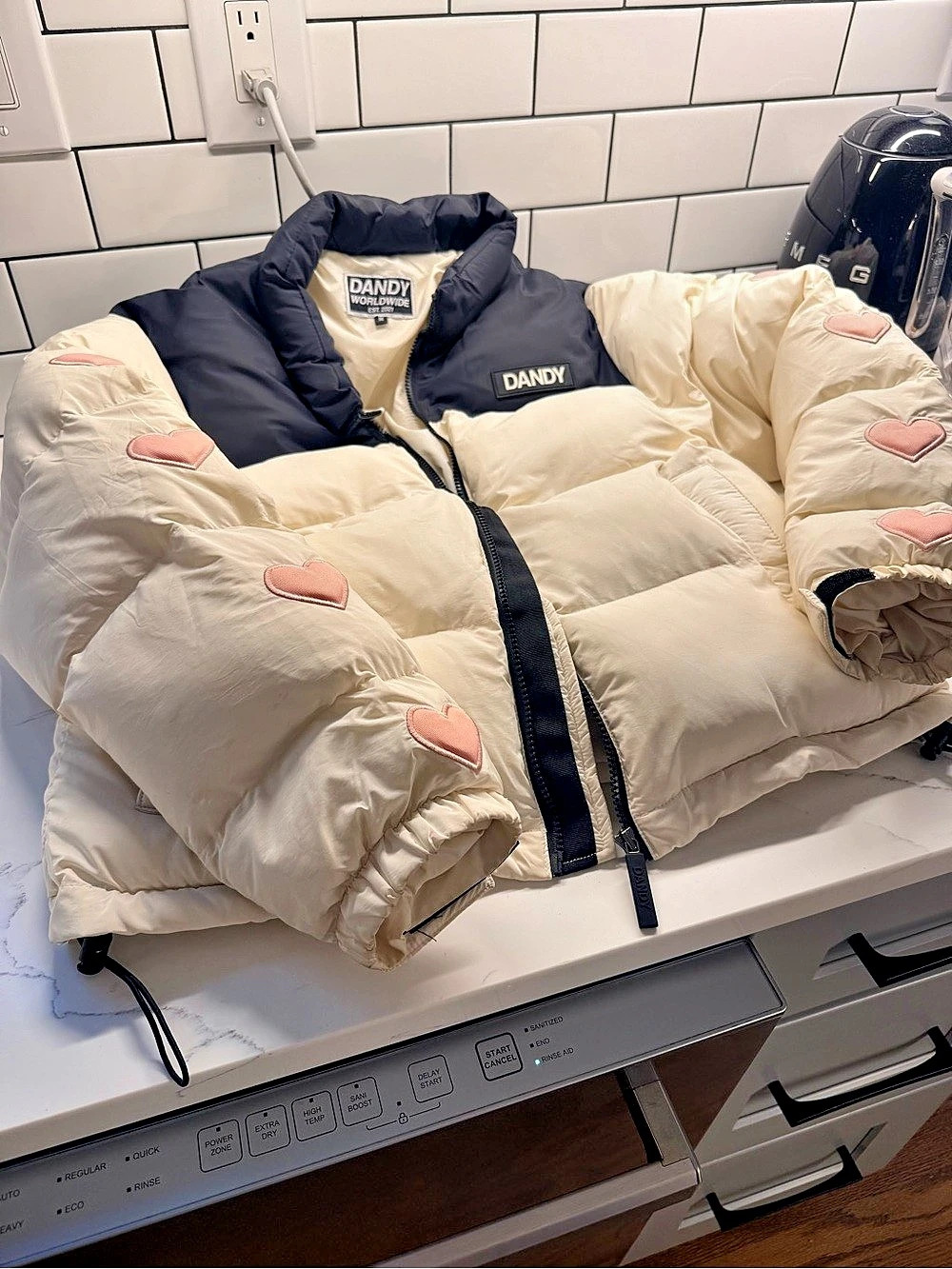 “Heart on my sleeve” Dandy Cream & Black Heart Patch Puffer Like New
